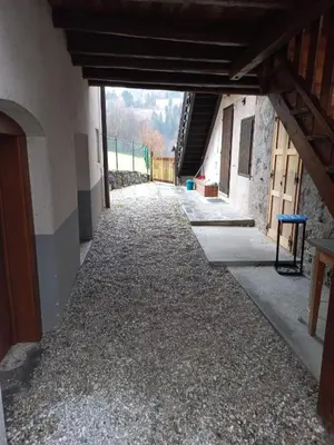 an empty hallway of a building with gravel at Casa Sartorin in Canale San Bovo