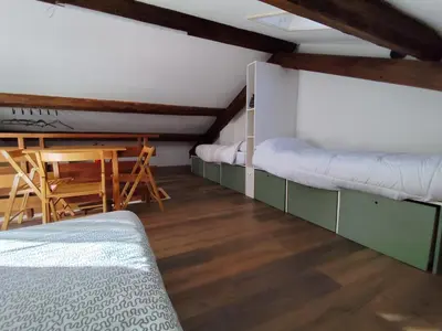 a room with a bed and a table and a desk at Casa Relax in Canale San Bovo