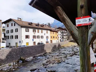 a view of a river in a town with buildings at Casa Righini in Moena