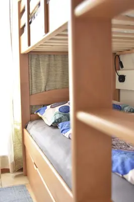 a bunk bed in a bunk room with a bunk bed in a bedroom at T&B MOUNTAIN VIEW in Monguelfo