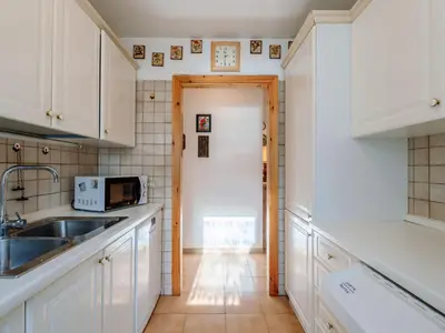 a hallway with a bedroom and a bed in a room at Apartment Mason Scarzin by Interhome in Alba di Canazei