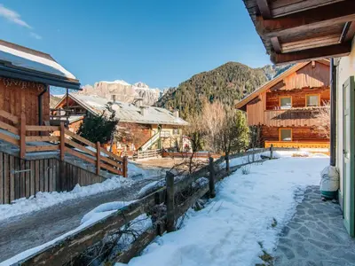 a building with snow on the side of it at Apartment Mason Scarzin by Interhome in Alba di Canazei