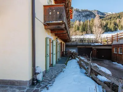 a building with snow on the ground next to a building at Apartment Mason Scarzin by Interhome in Alba di Canazei