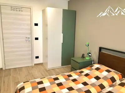 a bathroom with a shower with a glass door at anna’s sweet home in Tesero