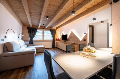 a living room with a dining table and a couch at - Piz Boe - Canazei center app. in Canazei