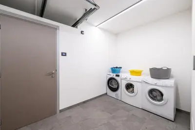 a laundry room with a washer and dryer at - Punta Penia - Canazei center app in Canazei