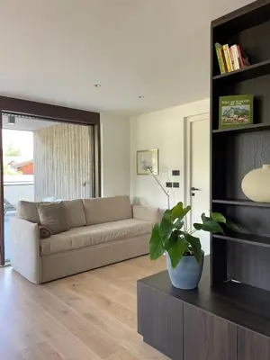 a living room with a couch and a table at Apartment Malfi in Fiè