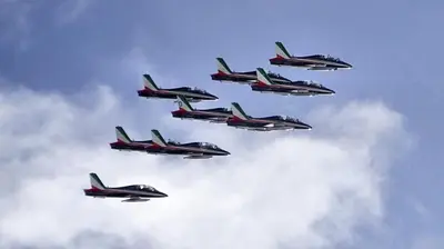 a group of fighter jets flying in formation in the sky at Ciasa Gabriel in Colfosco
