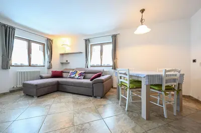 a living room with a couch and a table at Casa Lief in Mazzin