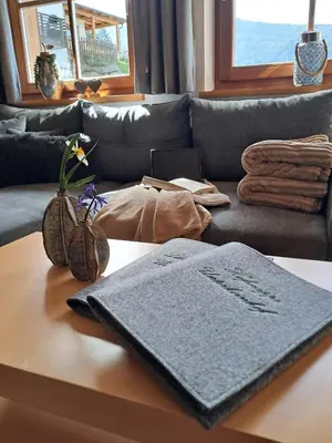 a living room with a couch and a table at Unterkirnhof in Schenna