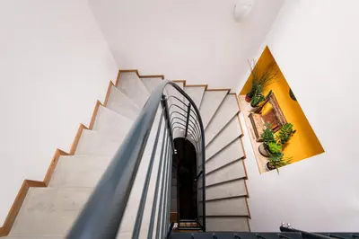 an escalator leading up to a staircase in a building at Am Schloss Guest House in Brunico