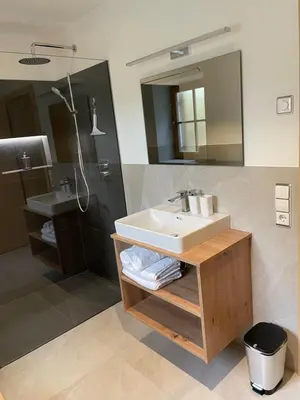 a bathroom with a sink and a mirror at Ferienhaus Gann - Greit in Villandro