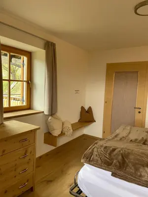 a bedroom with a bed and a window at Ferienhaus Gann - Greit in Villandro