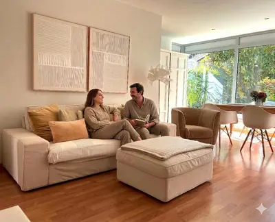 a living room with a white couch and a table at Villa Maria in Rablà