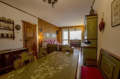 a dining room with a table and chairs in it at Villa Aurora in Pocol