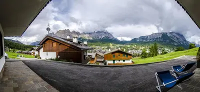 a view of a village from a round window at Villa Aurora in Pocol