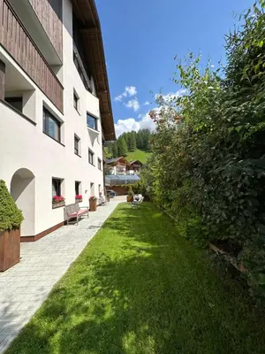 a light on the side of a wall with the word polka at Apartment Ciasa Laoi in San Cassiano