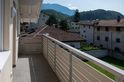 a balcony with a fence and some buildings at Apartment Residence Veronika in Ora/Auer