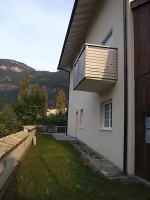 a house with a solarium on the side of it at Apartment Residence Veronika in Ora/Auer