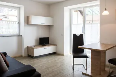 a living room with a couch and a table at Apartment Residence Veronika in Ora/Auer