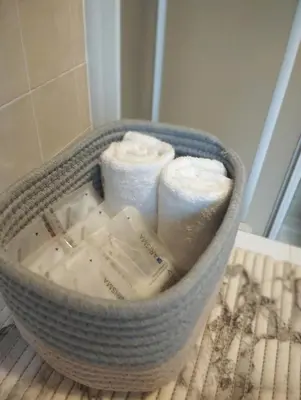 a basket filled with towels on a table at La casa dello scoiattolo primierotto in Tonadico
