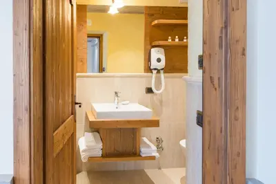 a bathroom with a sink and a mirror at Agritur Casa Fabri in Coredo