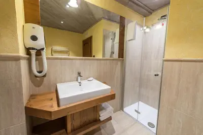 a bathroom with a sink and a shower at Agritur Casa Fabri in Coredo