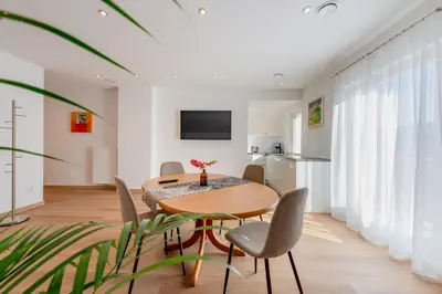 a dining room with a table and chairs at Residence 1963 - Apartments in Termeno