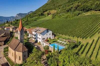 an aerial view of a villa in a vineyard at Runggnerhof in Termeno