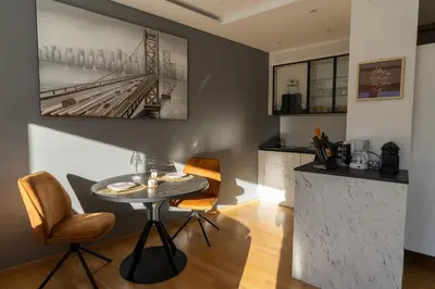 a dining room with a table and chairs at Ausblick Kleinjuwel mit Panoramablick + Garage in Merano