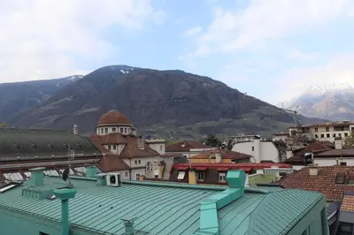 a view of a city with a mountain in the background at Ausblick Kleinjuwel mit Panoramablick + Garage in Merano