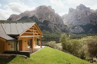 a house with a view of mountains at Chalet Lärchenhof in Colfosco
