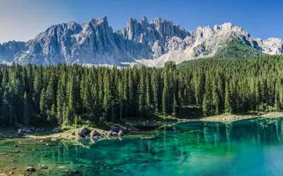 a view of a lake with mountains in the background at LAKE & RIVER Hotel in Carezza al Lago