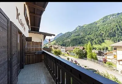 a balcony of a building with a view of a mountain at Appartamenti Callori Karin in Canazei