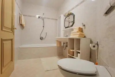 a bathroom with a toilet and a sink and a shower at Apartment Enrosadira Pedraces in Badia