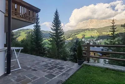 a balcony with a view of a mountain at Apartment Enrosadira Pedraces in Badia