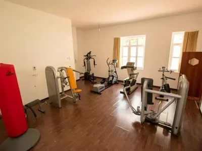 an empty room with several exercise bikes in it at Villaggio Turistico Ploner in Carbonin