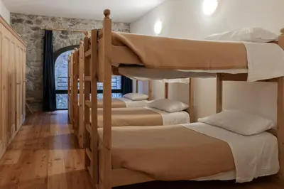 a group of bunk beds in a room at Ostello IMPERINA in Zenich