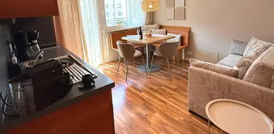 a living room with a couch and a table at Residence Ferienwohnungen Santner - Moderne zentrale Ferienwohnungen in Naturns Südtirol - mit Parkplatz in Naturno