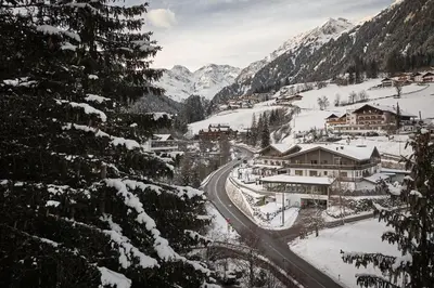 a village in the mountains covered in snow at Wellness-Sporthotel Ratschings in Racines
