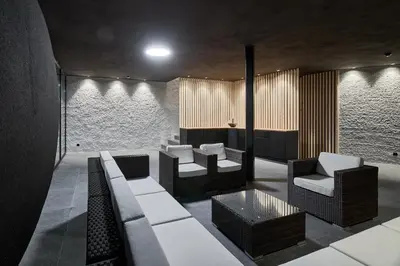 a living room with a couch and chairs at Wellness-Sporthotel Ratschings in Racines
