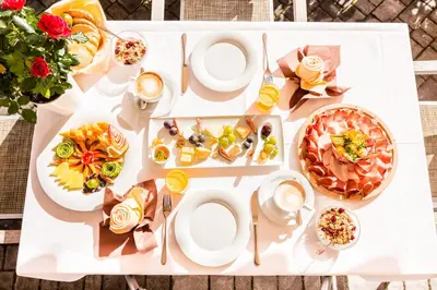 a white table with food on top of it at Wellness-Sporthotel Ratschings in Racines