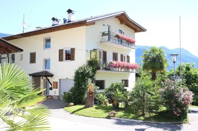 a villa with a garden in front of it at Haus Zöschg in Andrian