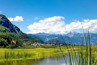a view of a valley with a lake and mountains at Haus Zöschg in Andrian
