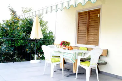 a table and chairs on a patio at Haus Zöschg in Andrian