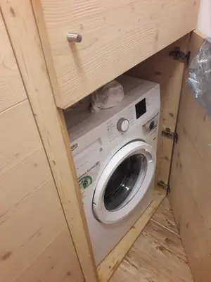 a washer and dryer in a tiny house at Casa De Sandre in San Vito di Cadore