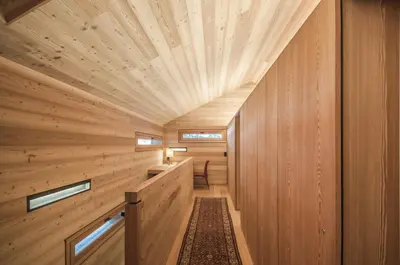 a sauna with wood paneling and a ceiling at Mountain Lodge Tamersc in San Vigilio Di Marebbe