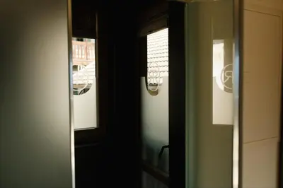 an open door with a window in a room at Langenmantel Historic Suites in Termeno