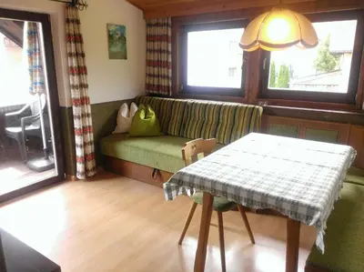 a living room with a couch and a table at Ferienwohnungen Schnarf in Valdaora