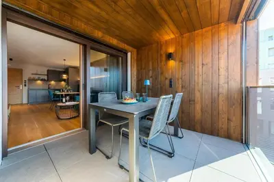 a dining room with a table and chairs at Rienz Alpine City Suites in Brunico